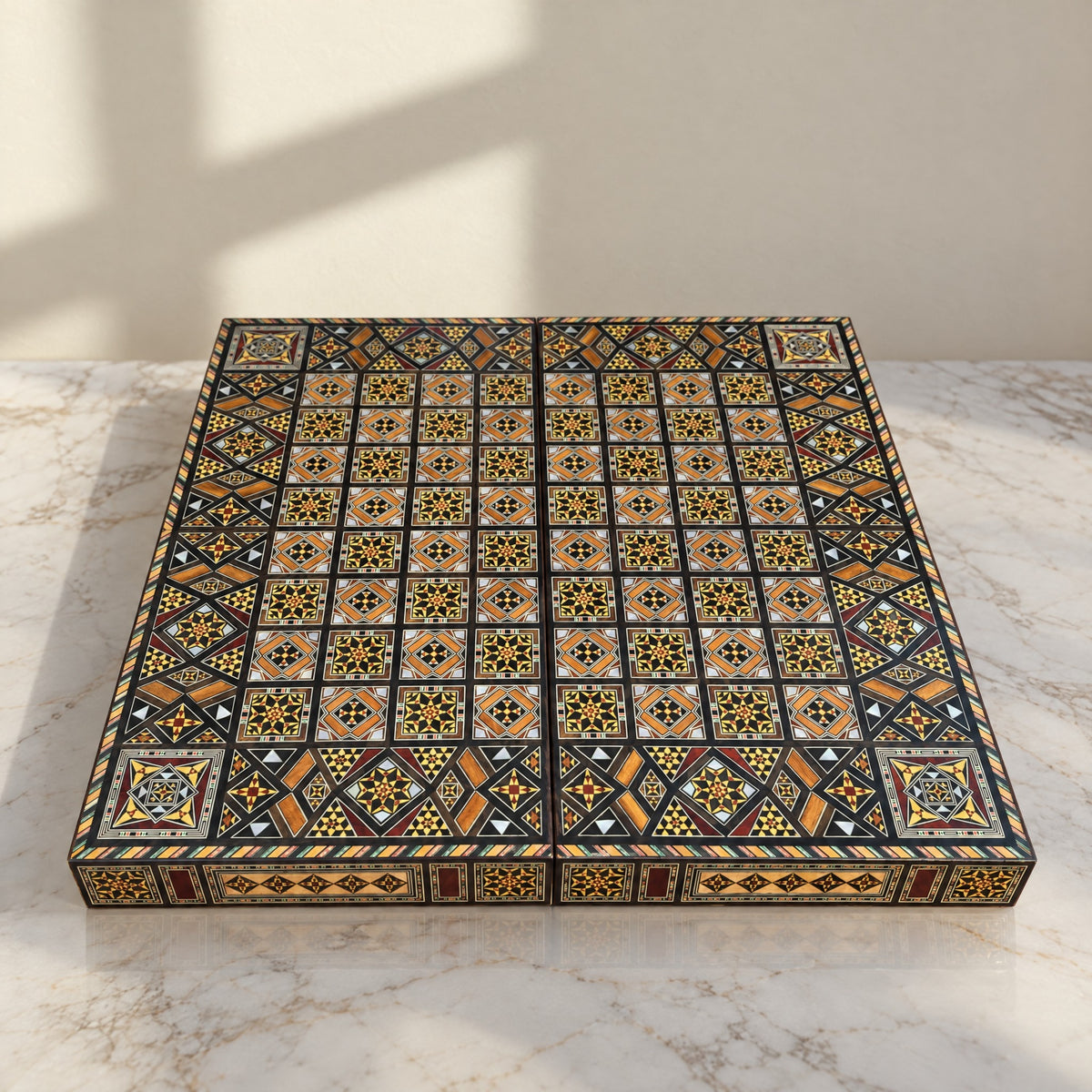 Royal Chess & Backgammon Set on a white marble table in warm window light