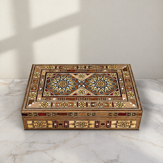 Majestic Mosaic Box, closed, on a white marble table in warm window light