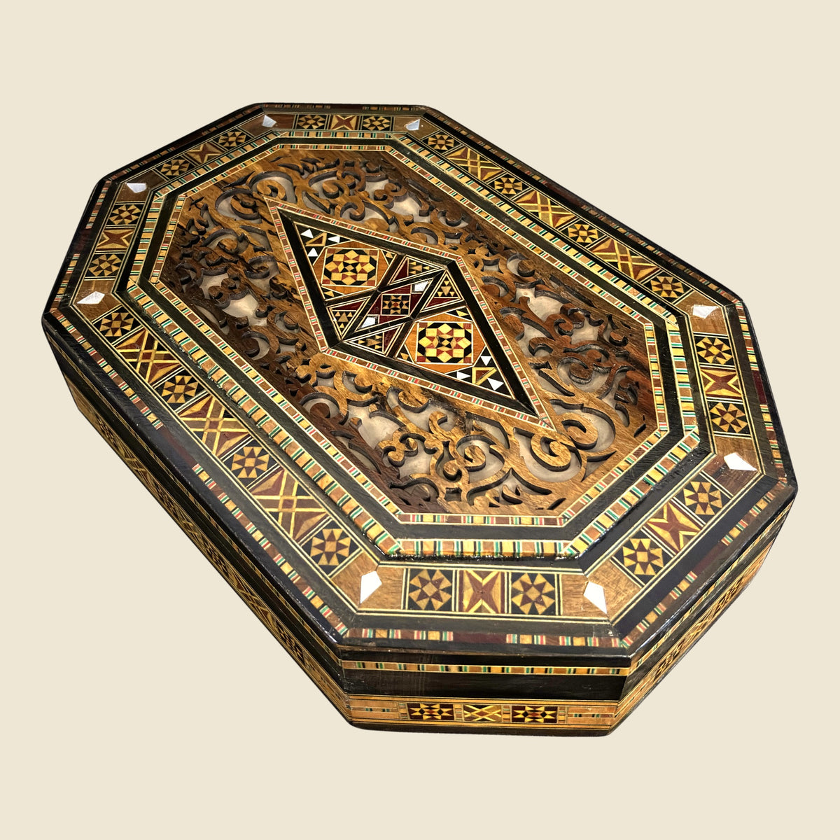 Sovereign Mosaic Box, closed, with a hand-carved relief lid and a mosaic diamond with mother-of-pearl inlay