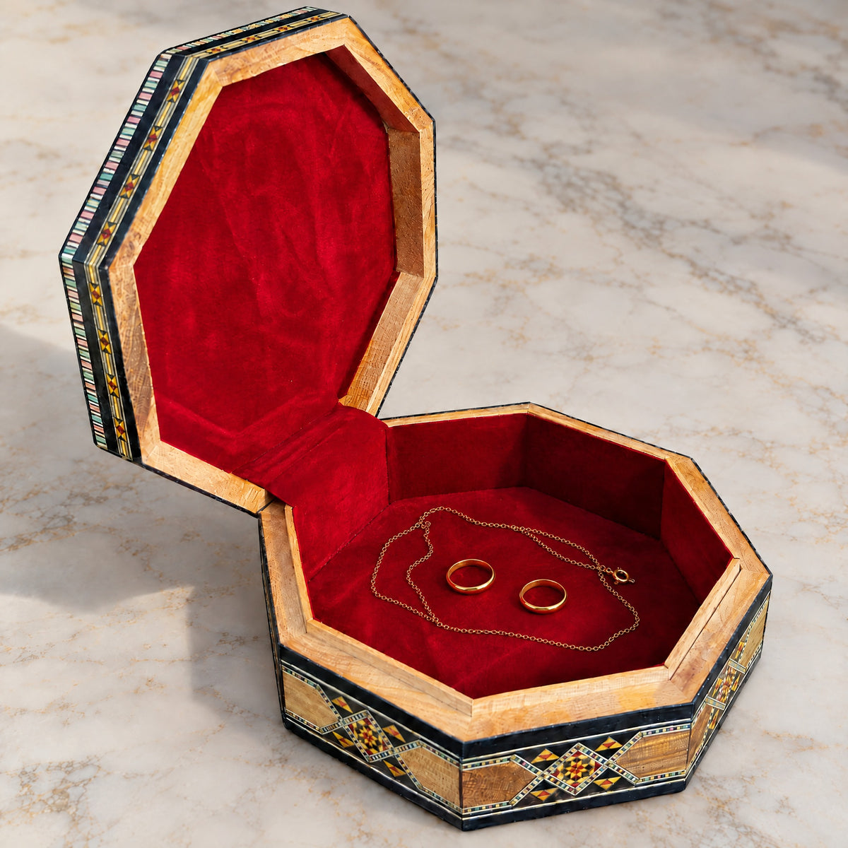 Palace Mosaic Box open on marble, velvet-lined interior with two rings and a chain