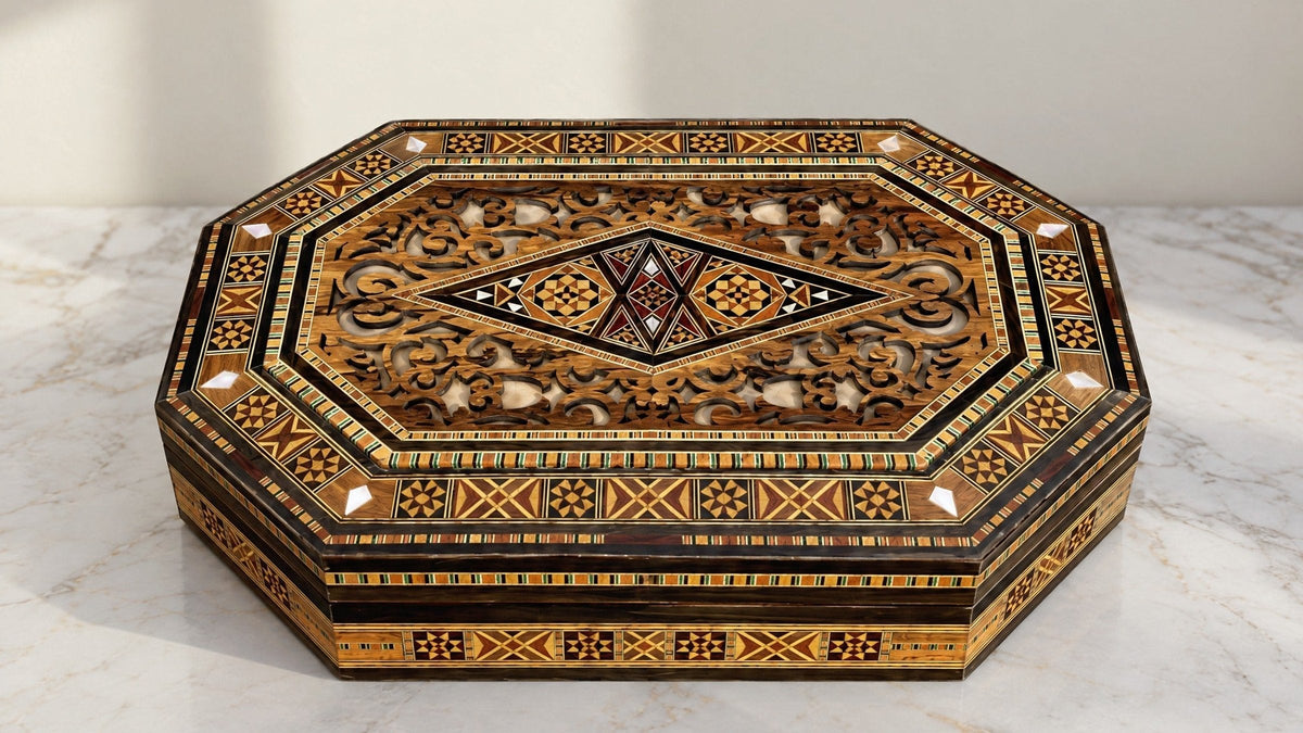 Sovereign Mosaic Box, closed, on a white marble table in warm window light
