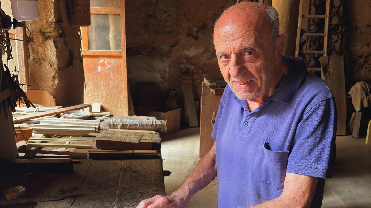 Gabriel Al-Dayeh (Abu Boutros) laying a mosaic panel in his workshop in Damascus