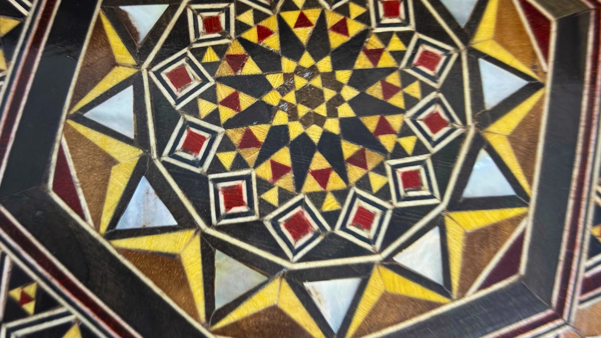 Close-up of an eight-sided Damascene mosaic pattern in wood and mother-of-pearl