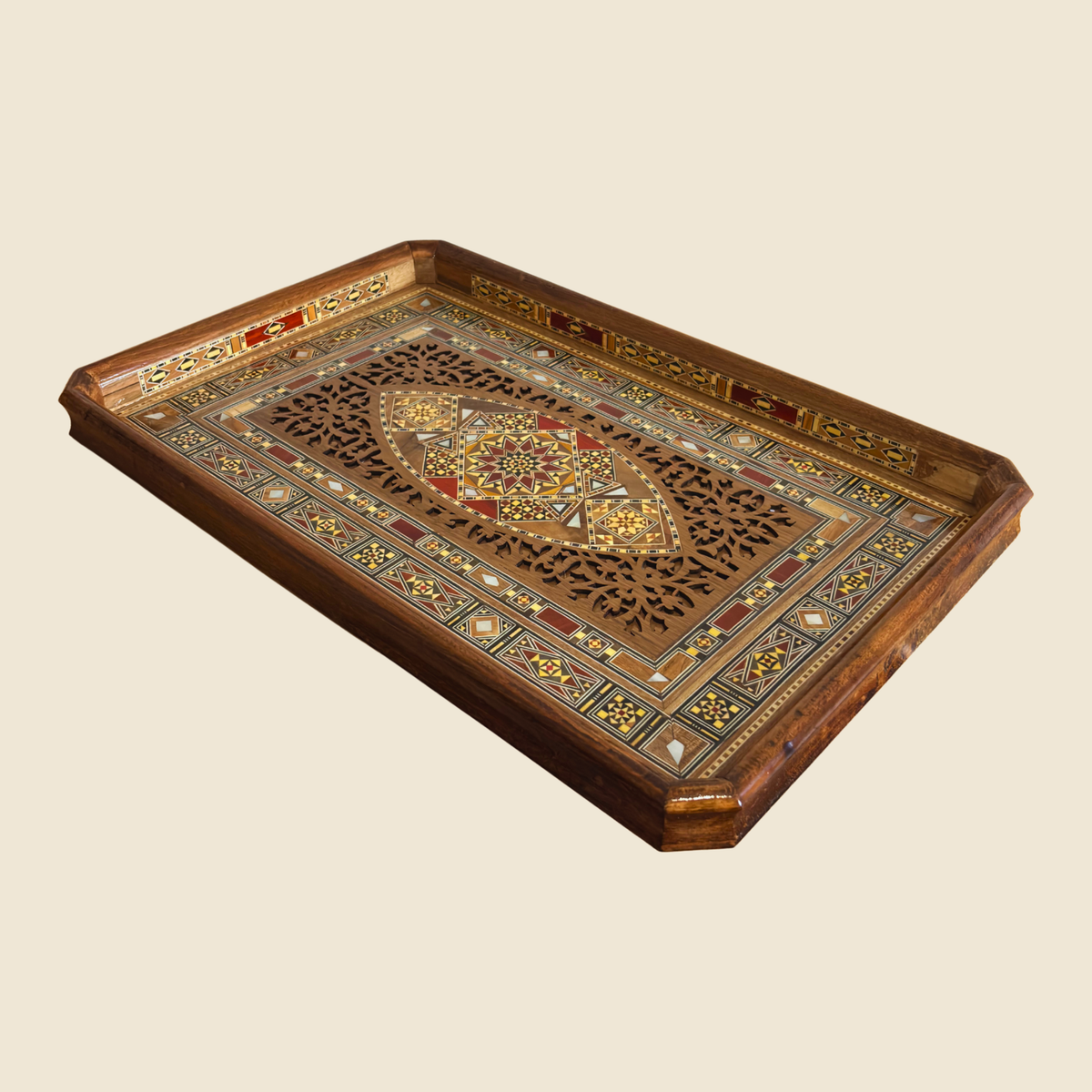 Sultana Tray, front view, with a pierced wood center and a mosaic border