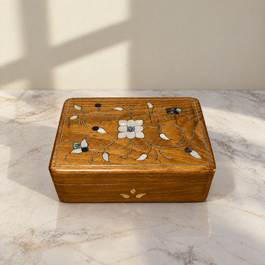 Prestige Carved Box on a white marble table in warm window light