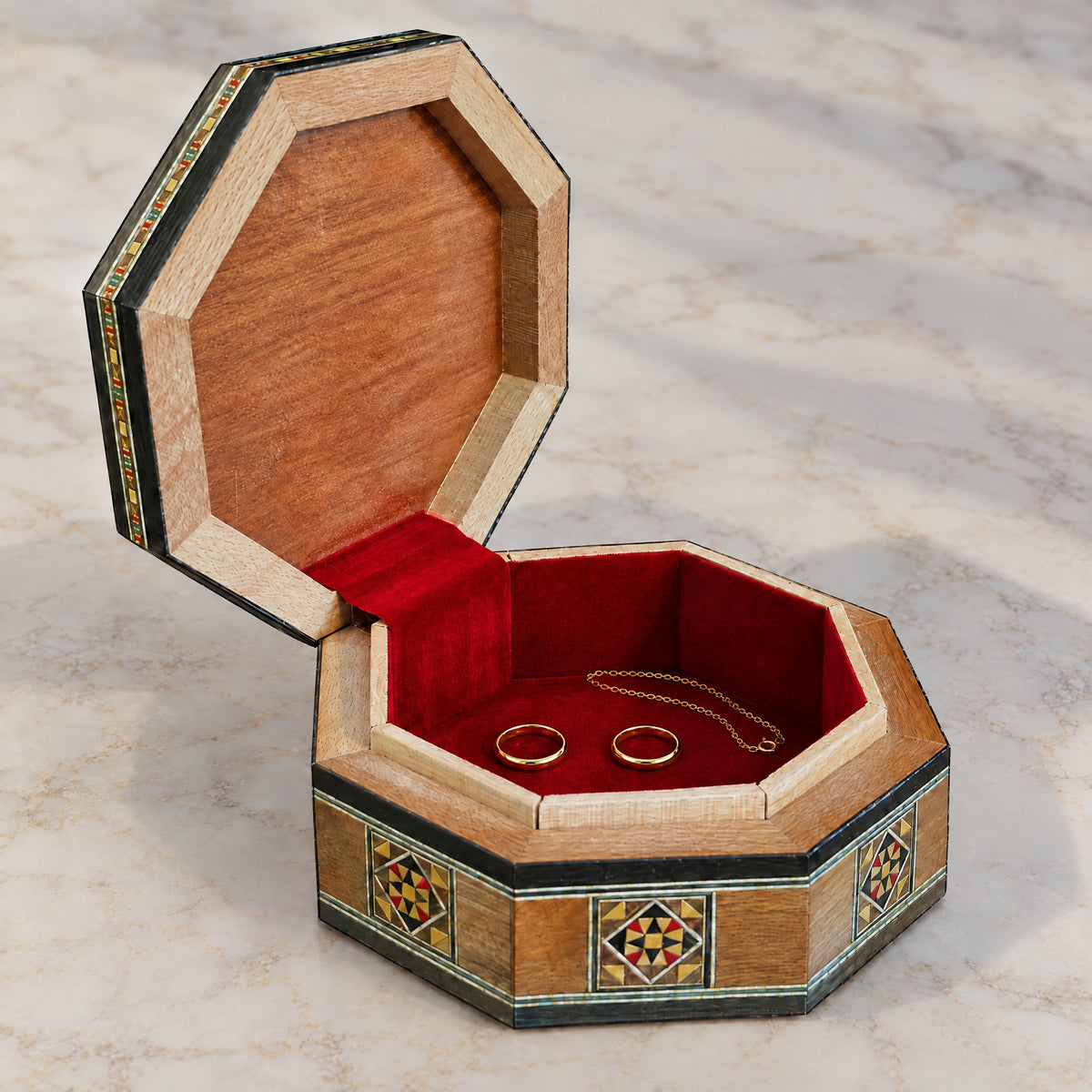 Star Mosaic Box open on marble, velvet-lined interior with two rings