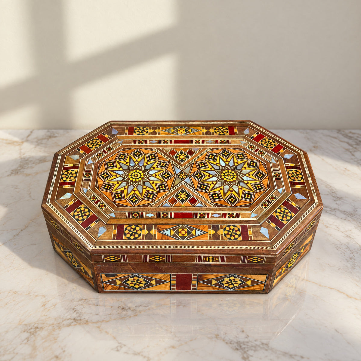 Artisan Mosaic Chest on a white marble table in warm window light