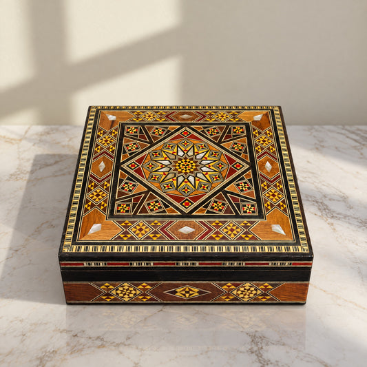 Ageless Mosaic Box on a white marble table in warm window light