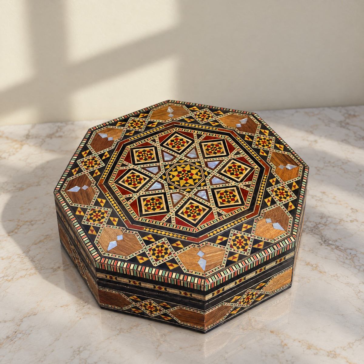 Generations Mosaic Box on a white marble table in warm window light