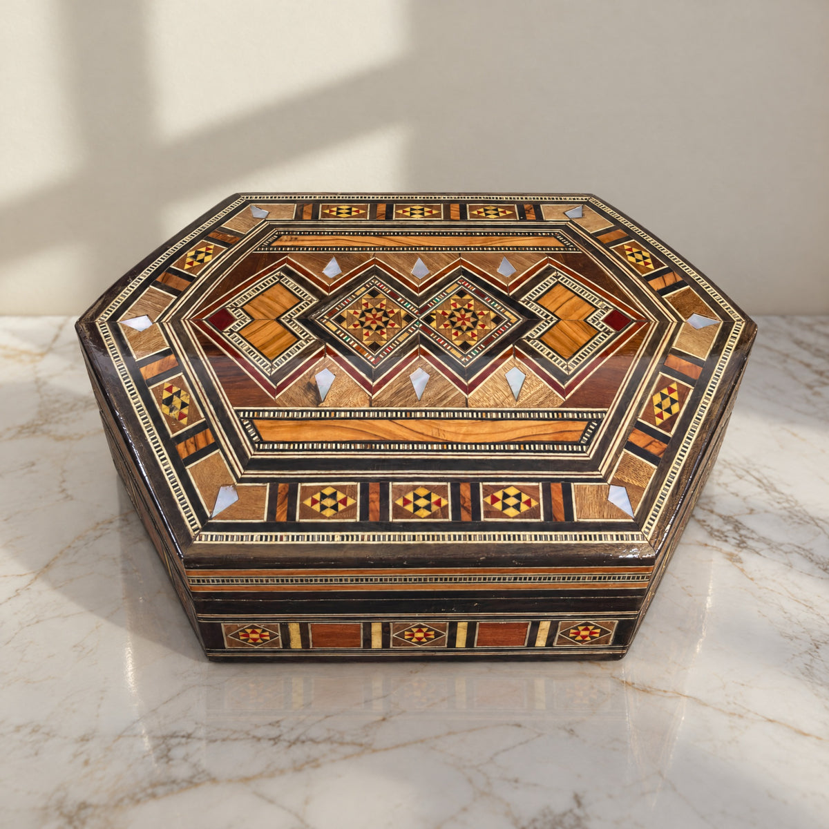 Harmony Mosaic Box on a white marble table in warm window light
