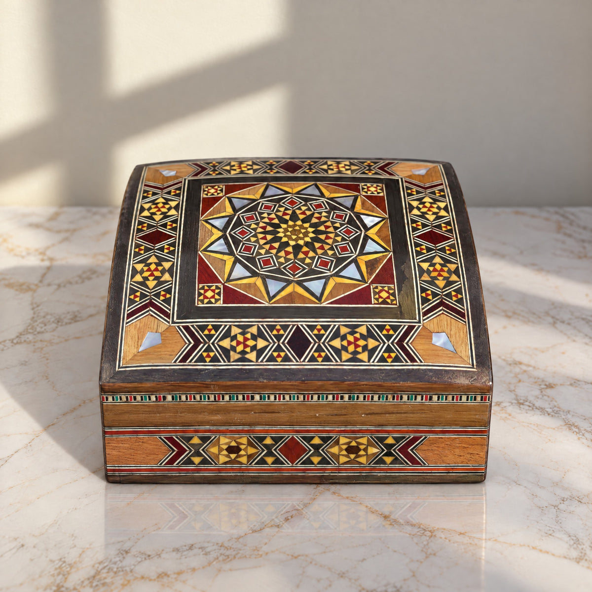 Serene Mosaic Box on a white marble table in warm window light