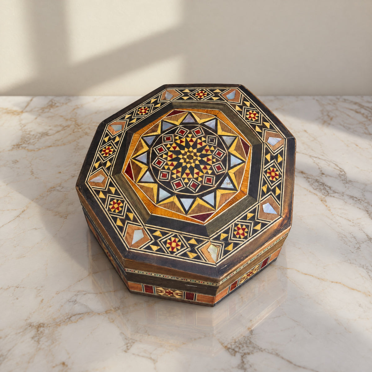 Radiant Mosaic Box on a white marble table in warm window light