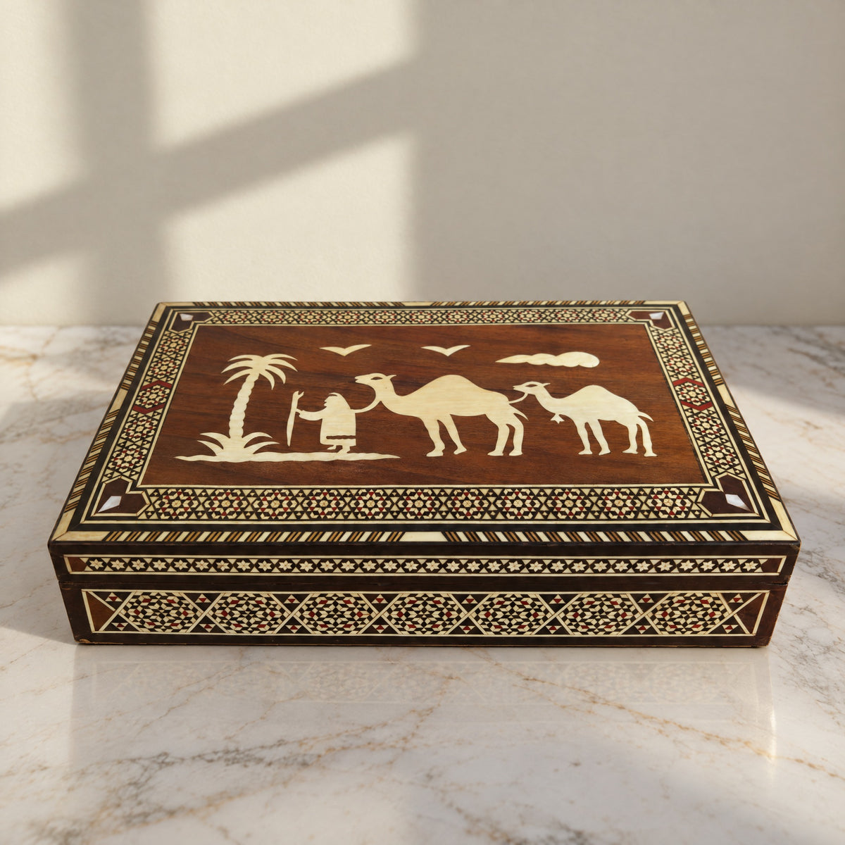 Caravan Mosaic Box on a white marble table in warm window light