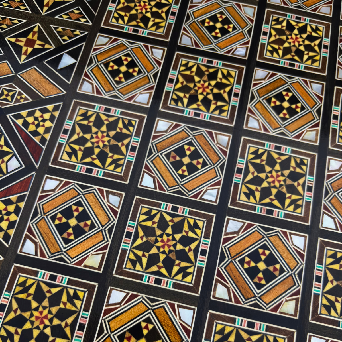 Close-up of the mosaic squares on the chess board side of the Royal Chess & Backgammon Set