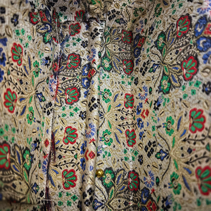 Close-up of the brocade interior lining inside the Layla Damascene Clutch