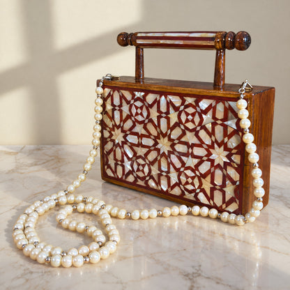 Rose Walnut Clutch, closed, on marble