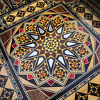 Close-up of the mosaic star and mother-of-pearl inside the backgammon board of the Dynastic Chess & Backgammon Set
