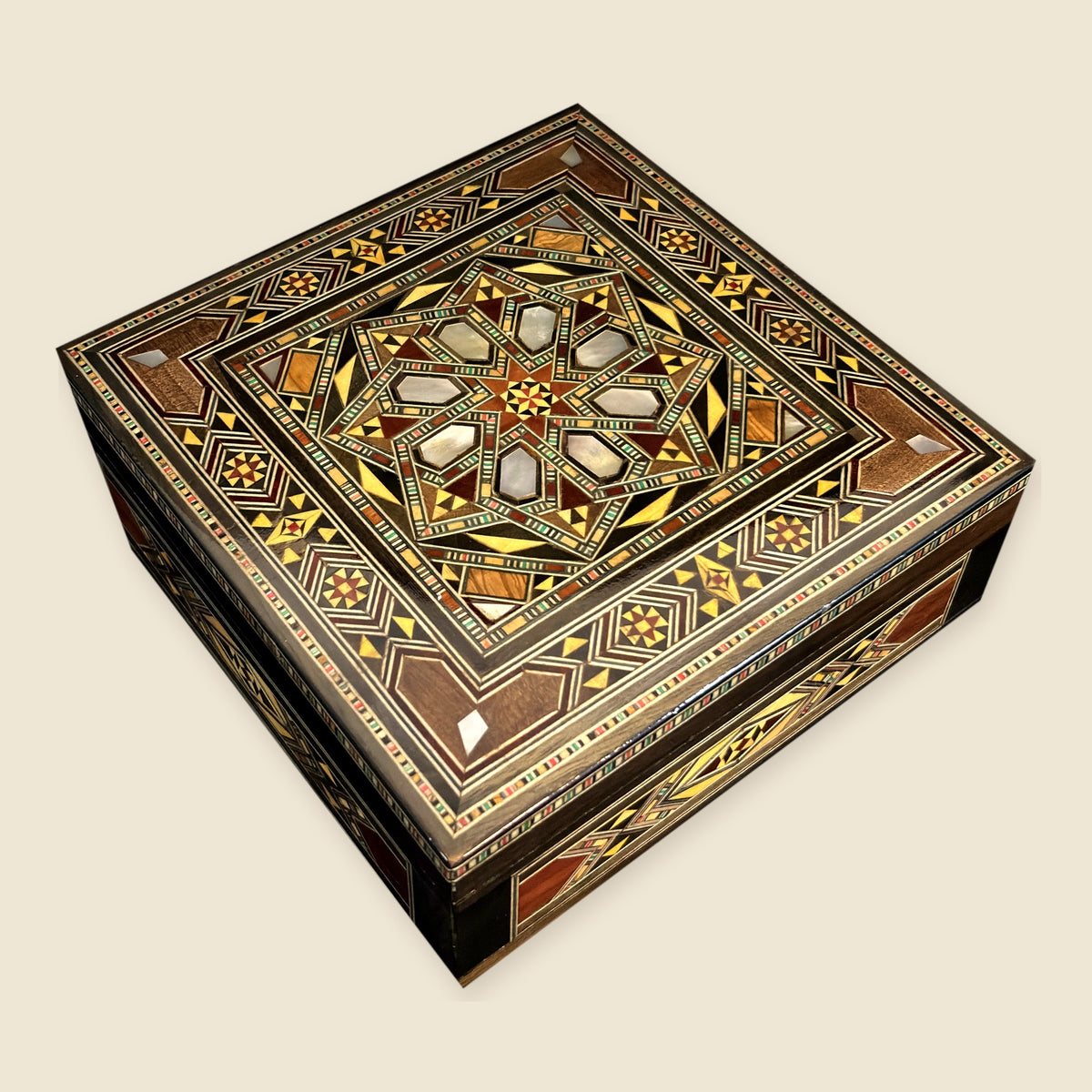 Tranquil Mosaic Box, closed, with a geometric mosaic lid and mother-of-pearl inlay