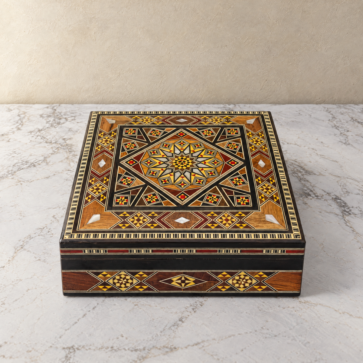 Oasis Mosaic Box, closed, on marble