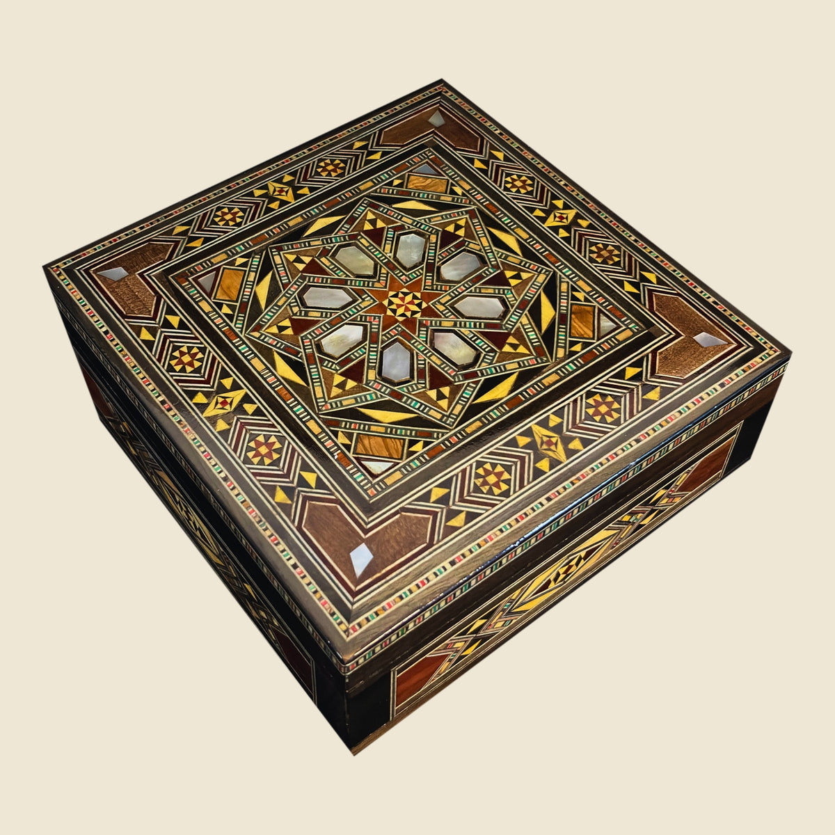 Tranquil Mosaic Box, closed, with a geometric mosaic lid and mother-of-pearl inlay