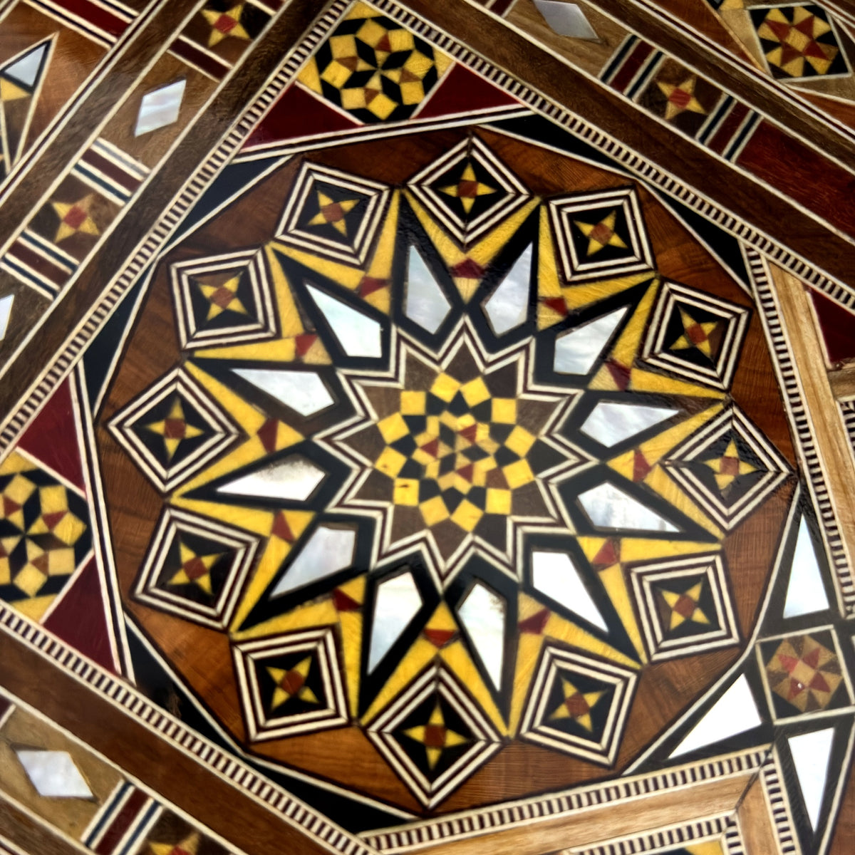 Close-up of the twelve-point mother-of-pearl star inlay on the lid of the Majestic Mosaic Box