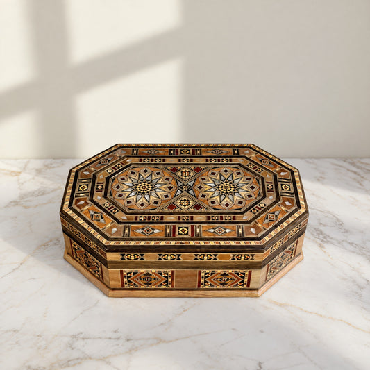 Resplendent Mosaic Box, closed, on a white marble table in warm window light