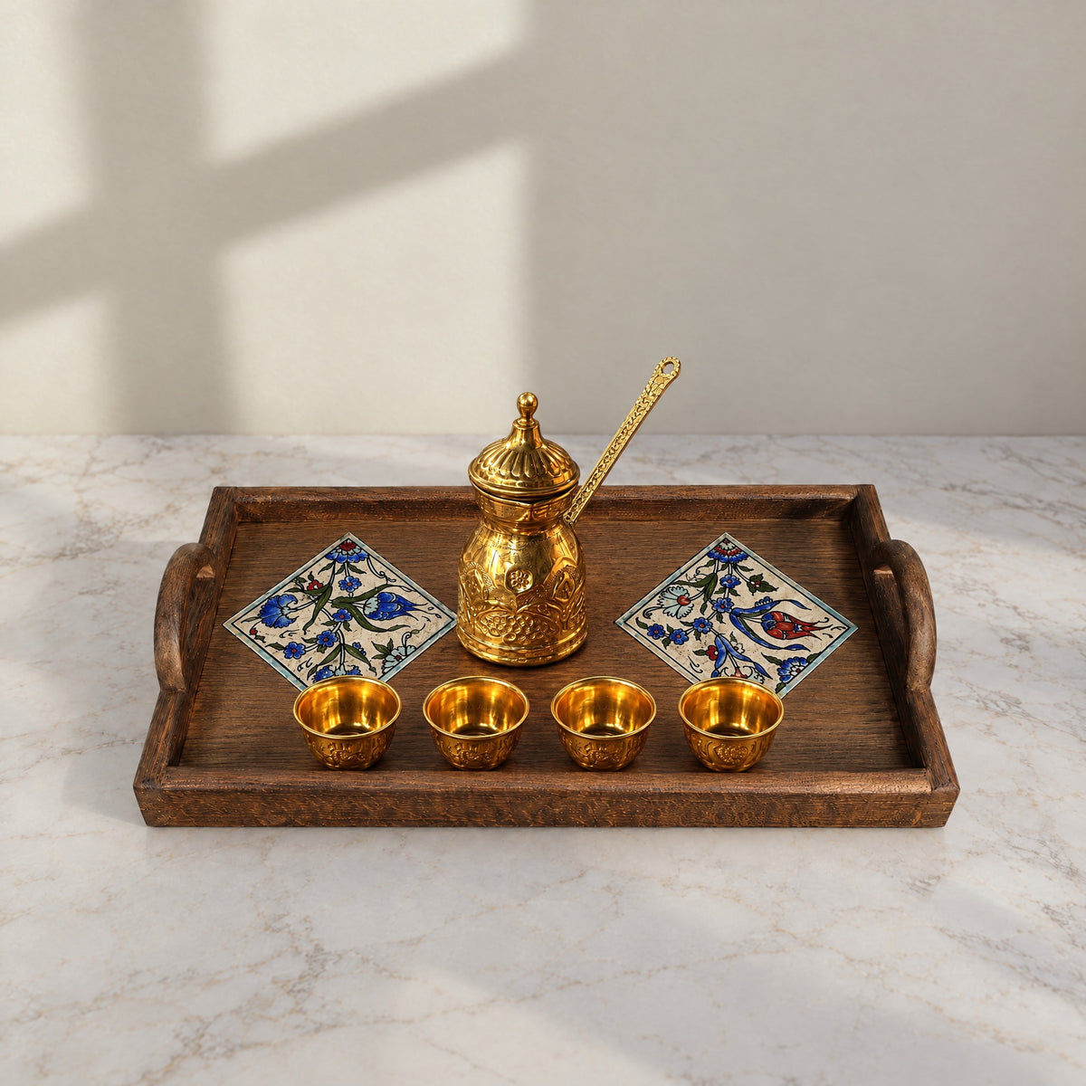 Jasmine Qishani tray on marble with a brass coffee pot and four gold cups