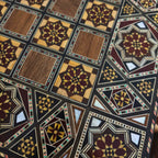 Close-up of the mosaic squares on the chess board side of the Grandmaster's Chess & Backgammon Set