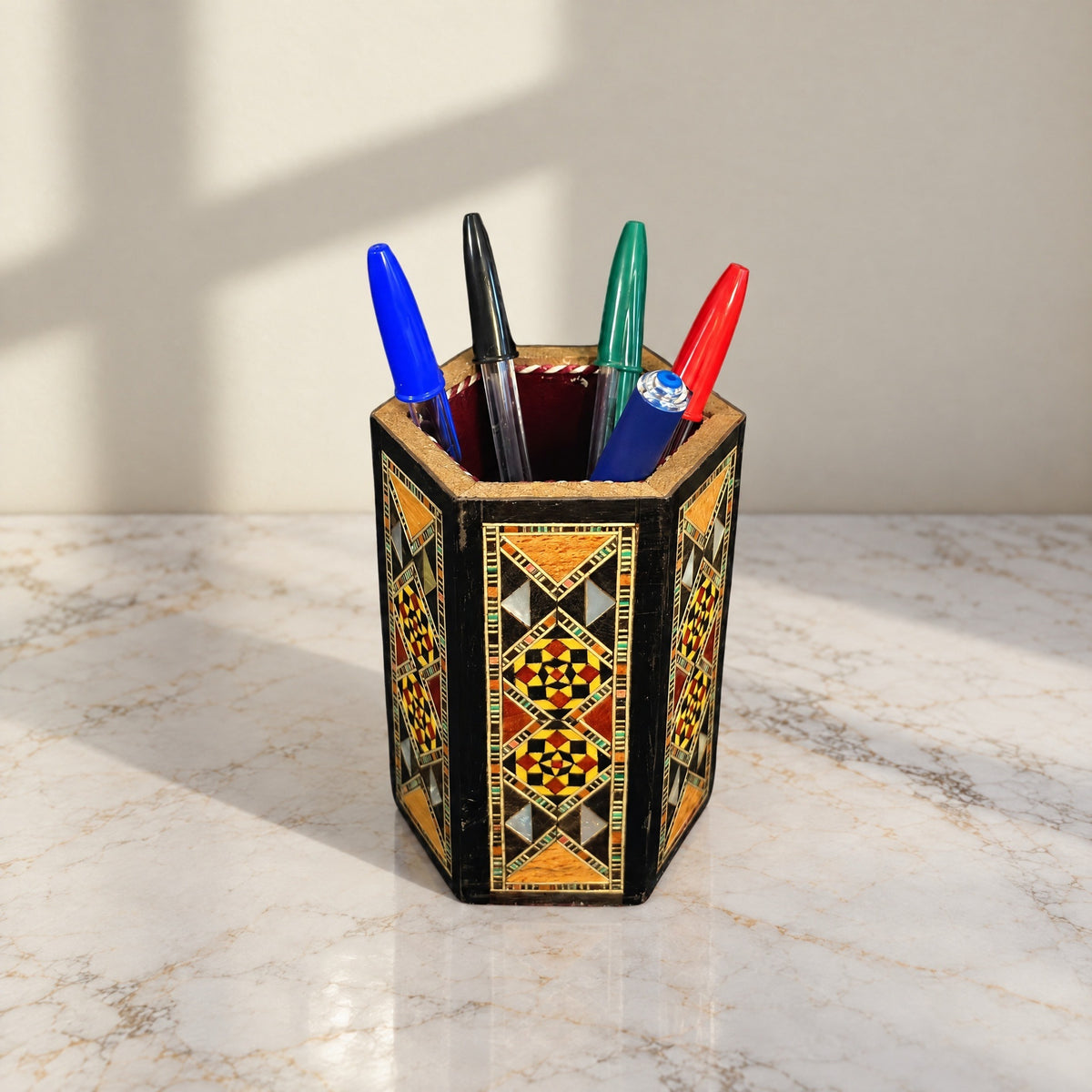 Calligrapher's Pen Holder on marble holding four pens