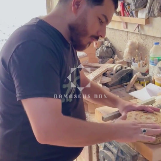 Mohammad Tarek Al-Dahh at work in his workshop in Damascus
