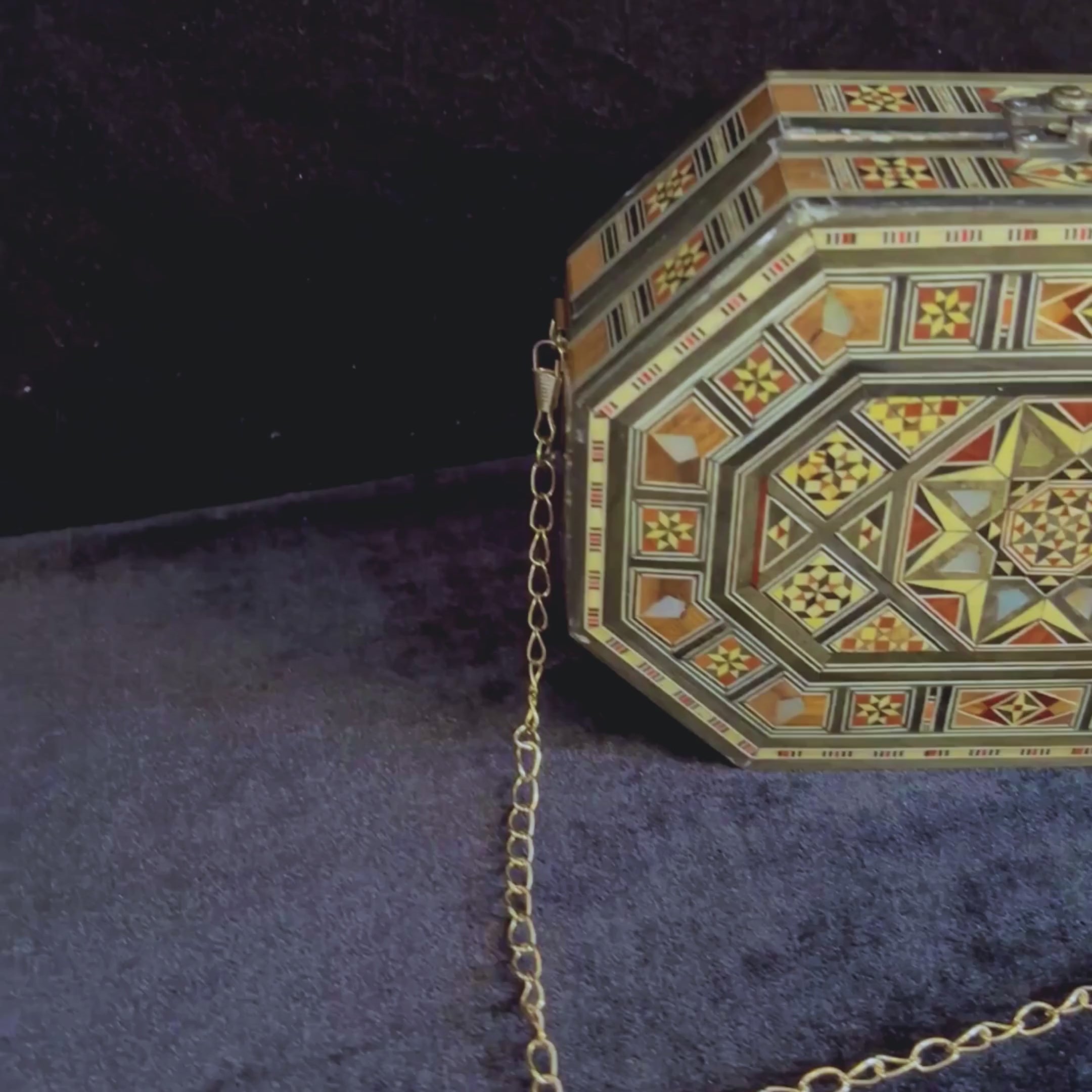 Qamar Damascene Clutch video: the clutch, a close-up of the inlay and the open clutch
