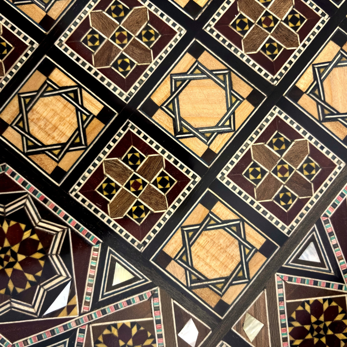 Close-up of the mosaic squares on the chess board side of the Sultan's Damascene chess and backgammon set
