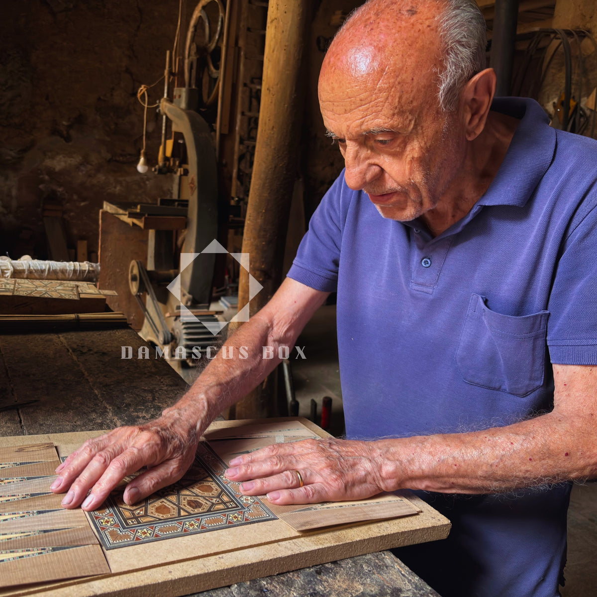 Damascus master artisan Gaby Al Dayeh at work inlaying a backgammon board